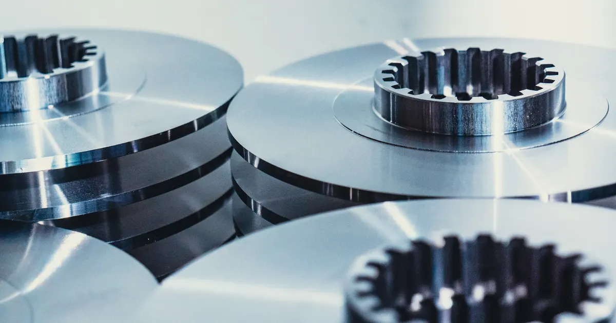 Polished steel discs with splined centres, an example of machined parts discussed in 303 vs 304 stainless machining