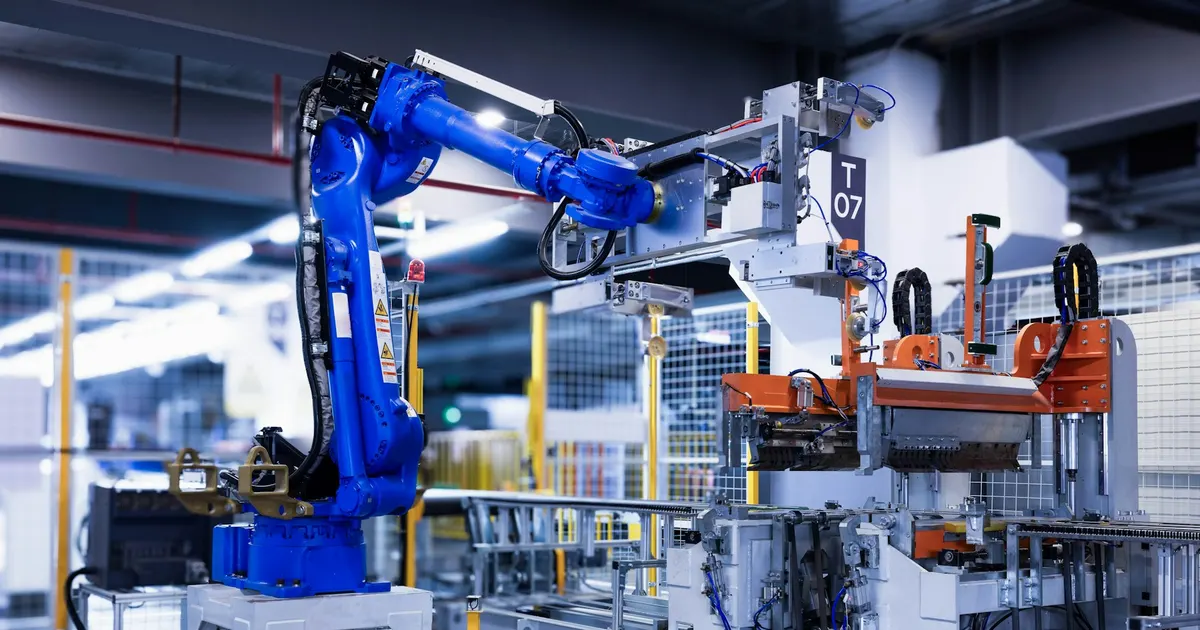 Blue industrial robot arms on an assembly line, equipment that uses machined automation parts